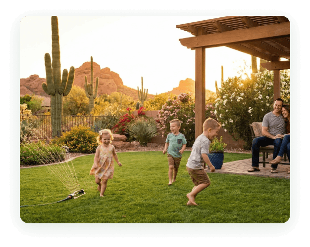 Kids playing on the grass in a Phoenix backyard treated for scorpions